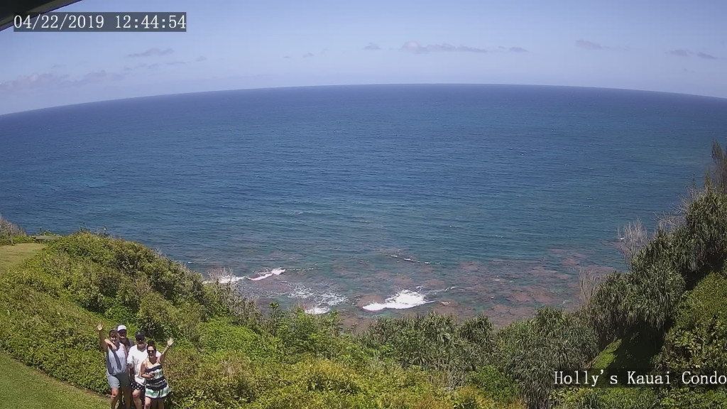 Beautiful oceanfront view from Hollys Kauai Condo's lanai web cam with people waving.